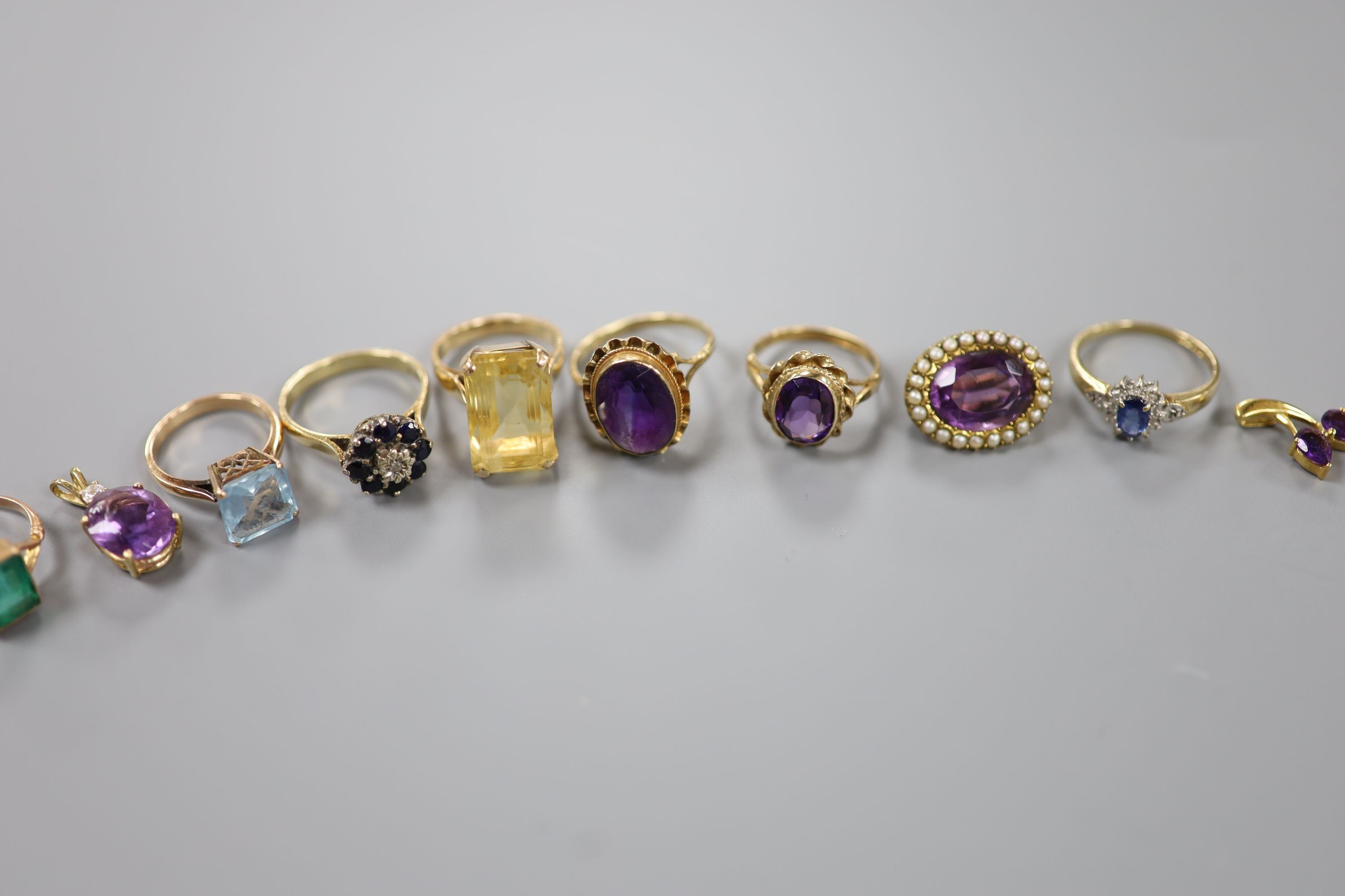 Mixed jewellery including five 9ct and gem set dress rings and a 9ct small pendant, gross 14.9 grams, an 18k and citrine ring and two 18k and amethyst set small pendants, gross 10 grams, a 15ct and amethyst brooch, gross